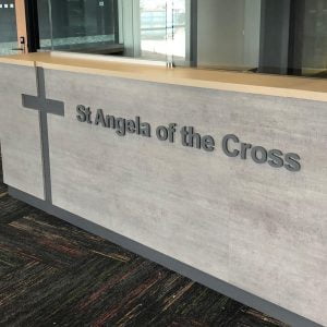 3D acrylic router cut letters for St Angela of The Cross School Reception counter