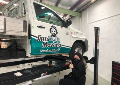 Jims Mowing franchise branding on 2 door ute